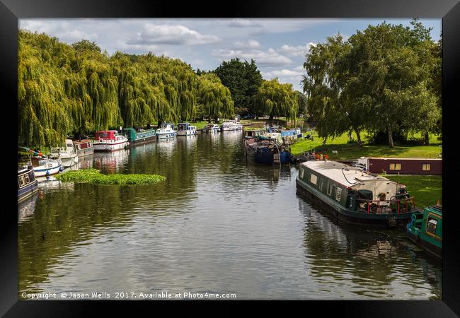 Boats line the river side of the River Great Ouse Framed Print by Jason Wells