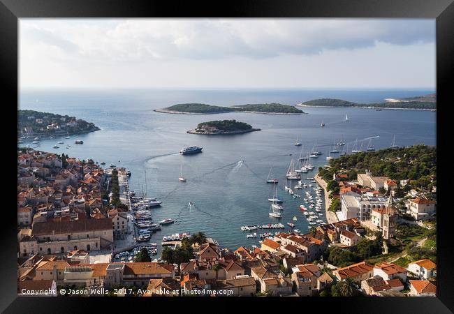 Yacht-dotted inlet of Hvar old town Framed Print by Jason Wells