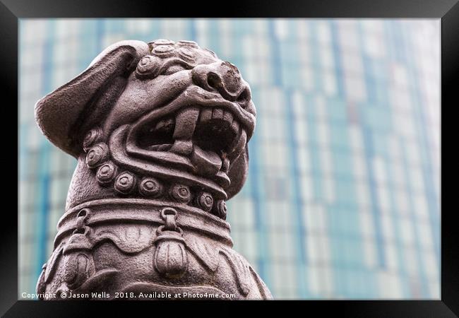 Lion statue against a modern background Framed Print by Jason Wells