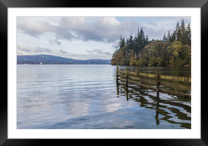 Reflection of a wooden fence Framed Mounted Print by Jason Wells