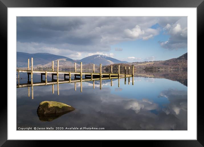 Wooden jetty lit up on Derwent Water Framed Mounted Print by Jason Wells