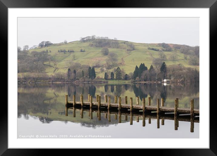 Jetty on the still waters of Consiston Lake Framed Mounted Print by Jason Wells