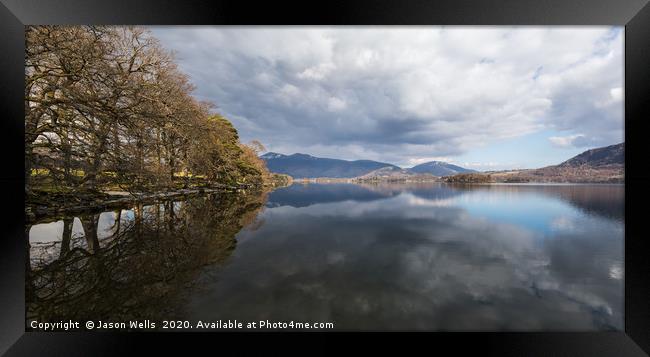 Trees and mountains reflect in Derwent Water Framed Print by Jason Wells