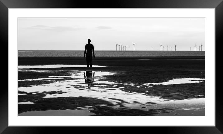 Iron Man looking out at a wind farm Framed Mounted Print by Jason Wells