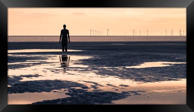 Iron Man reflecting in the pools of water Framed Print by Jason Wells