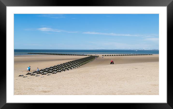 RNLI quad bike monitoring the incoming tide Framed Mounted Print by Jason Wells