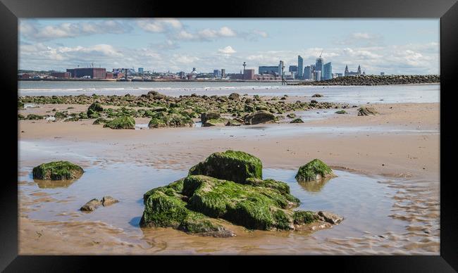 Overlooking rock pools towards Liverpool Framed Print by Jason Wells