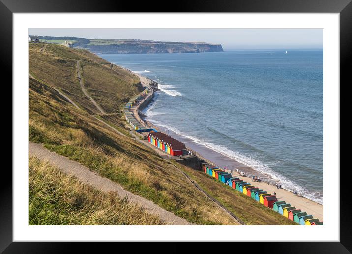 Beach huts on the Whitby seafront Framed Mounted Print by Jason Wells