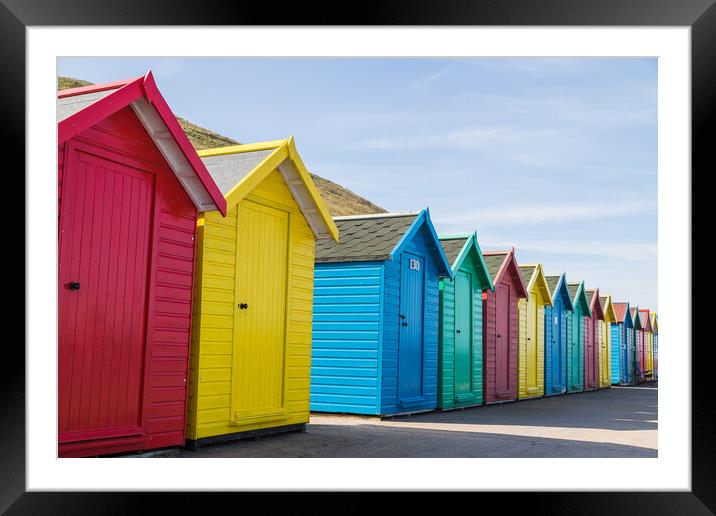 Pretty beach huts in Whitby Framed Mounted Print by Jason Wells