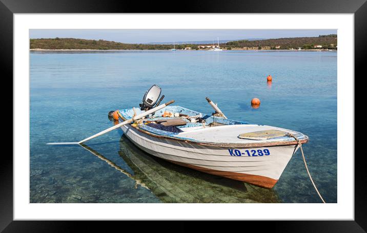 Fishing boat in the shallow waters Framed Mounted Print by Jason Wells