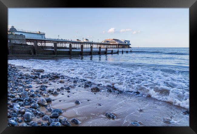 Waves lap the beach at Cromer Framed Print by Jason Wells