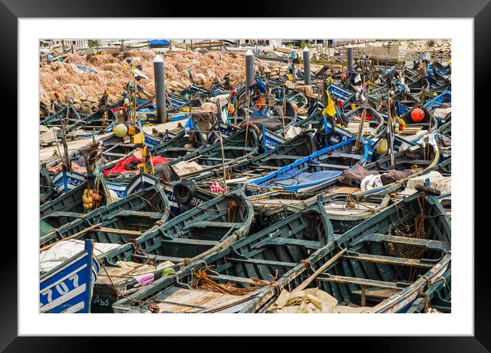 Wooden fishing boats lined up in Agadir harbour Framed Mounted Print by Jason Wells