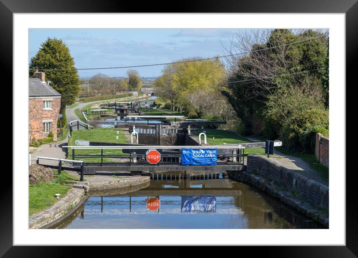 Locks reflecting in the water of Leeds Liverpool canal Framed Mounted Print by Jason Wells