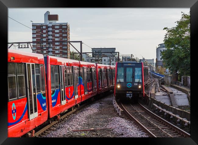Trains passing on the DLR Framed Print by Jason Wells