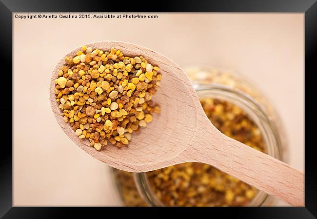 pollen grains portion on wooden spoon  Framed Print by Arletta Cwalina