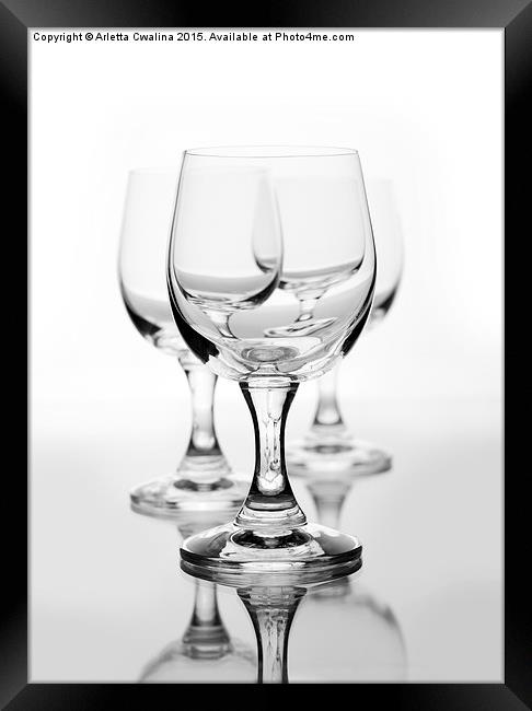 Three empty wine glasses on white  Framed Print by Arletta Cwalina