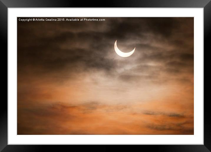 Partial solar eclipse and clouds morning sky  Framed Mounted Print by Arletta Cwalina