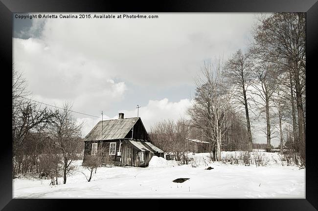 dilapidated wooden house in winter Framed Print by Arletta Cwalina