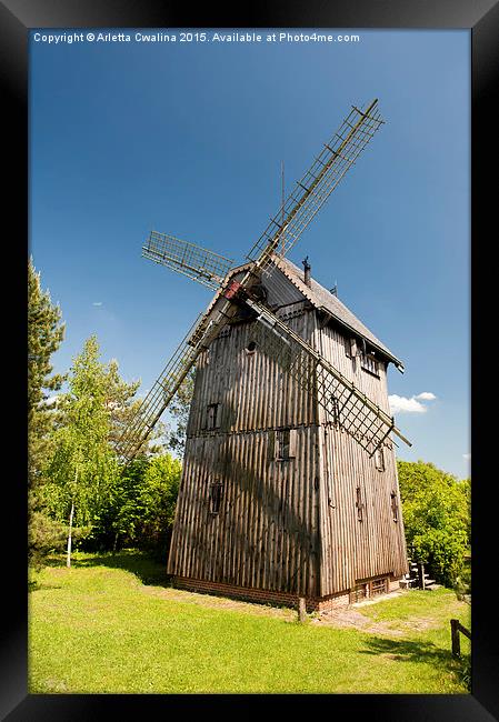 Old wooden windmill building Framed Print by Arletta Cwalina