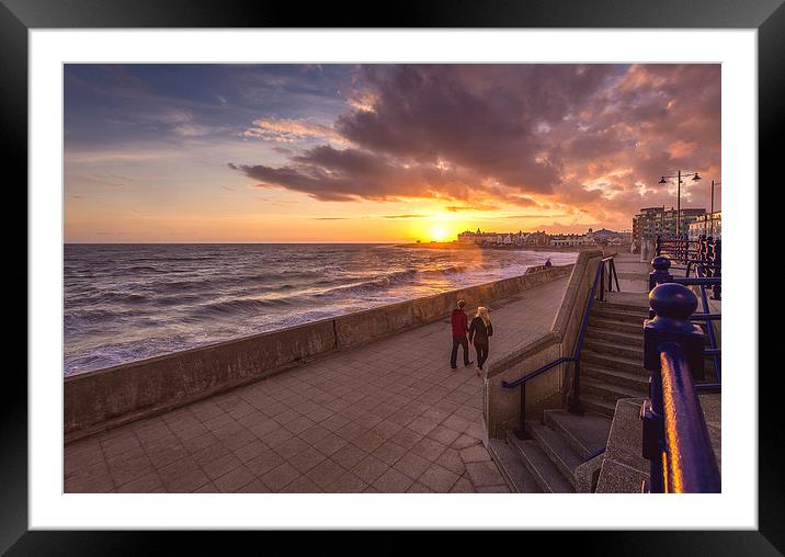   Couple enjoying the Porthcawl sunset Framed Mounted Print by Dean Merry