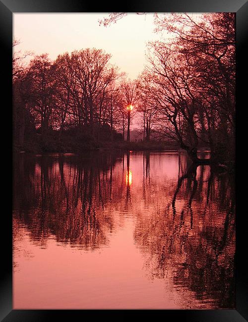 Sunset over lake Framed Print by Michael Hopes