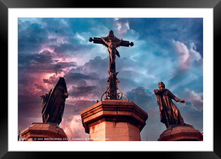 Christ statue with stormy sky Framed Mounted Print by Ann Biddlecombe