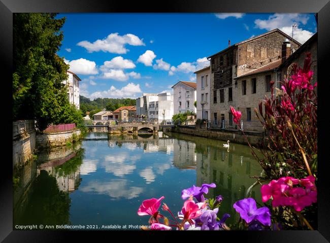 Joinville in France over the canal Framed Print by Ann Biddlecombe