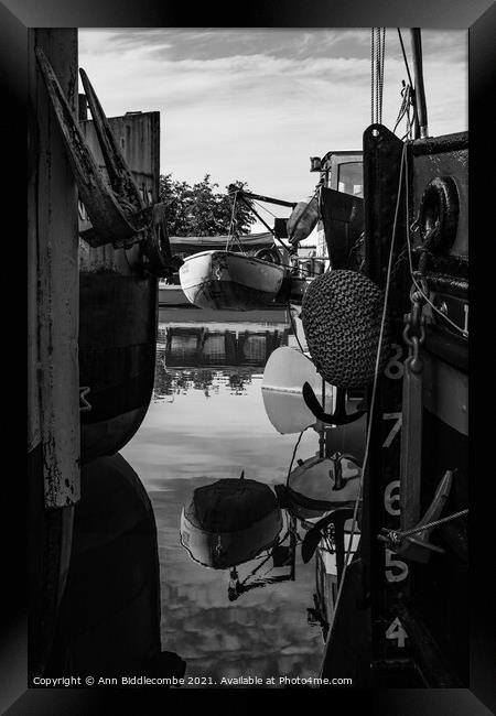 Reflections between barges in monochrome Framed Print by Ann Biddlecombe