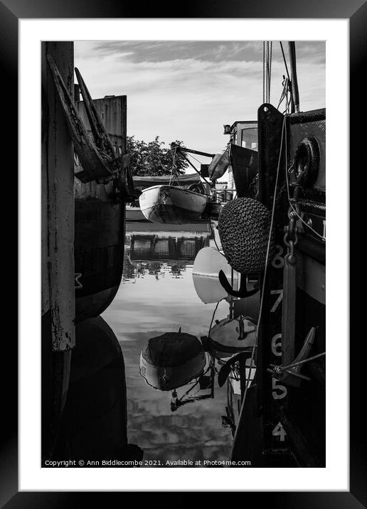 Reflections between barges in monochrome Framed Mounted Print by Ann Biddlecombe