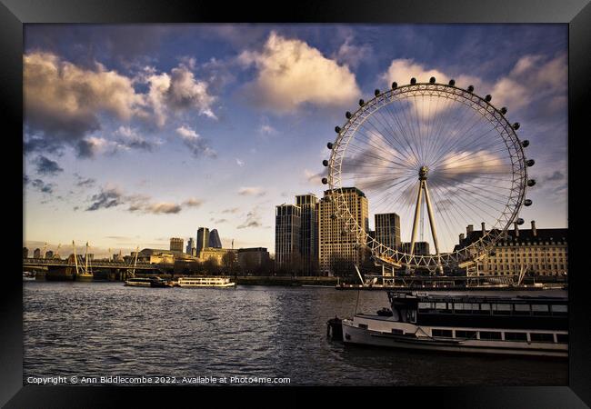 The London eye and boats on the Thames Framed Print by Ann Biddlecombe