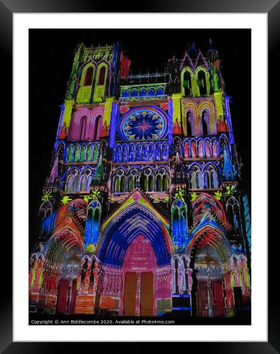 outdoor church lit up with colour Framed Mounted Print by Ann Biddlecombe