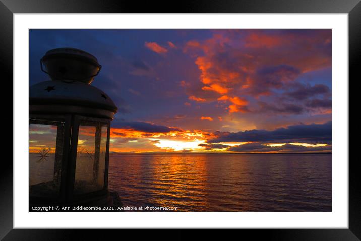 Sunset over the Lagoon with an old lantern Framed Mounted Print by Ann Biddlecombe