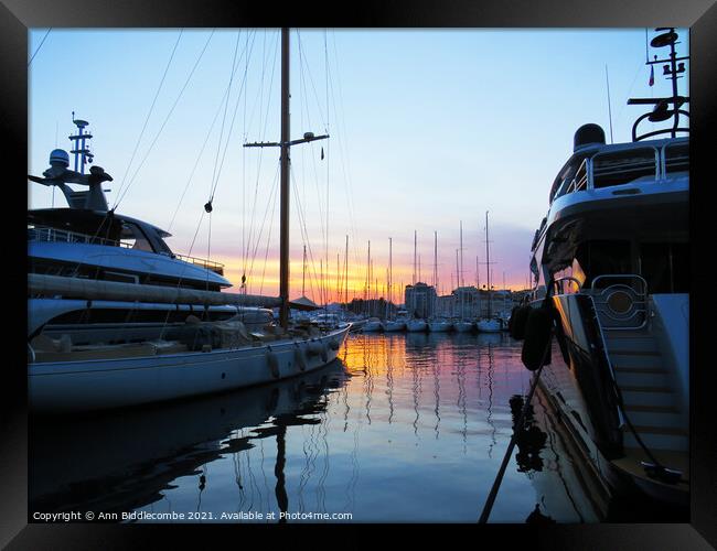  Sunset behind the boats in Cannes Framed Print by Ann Biddlecombe