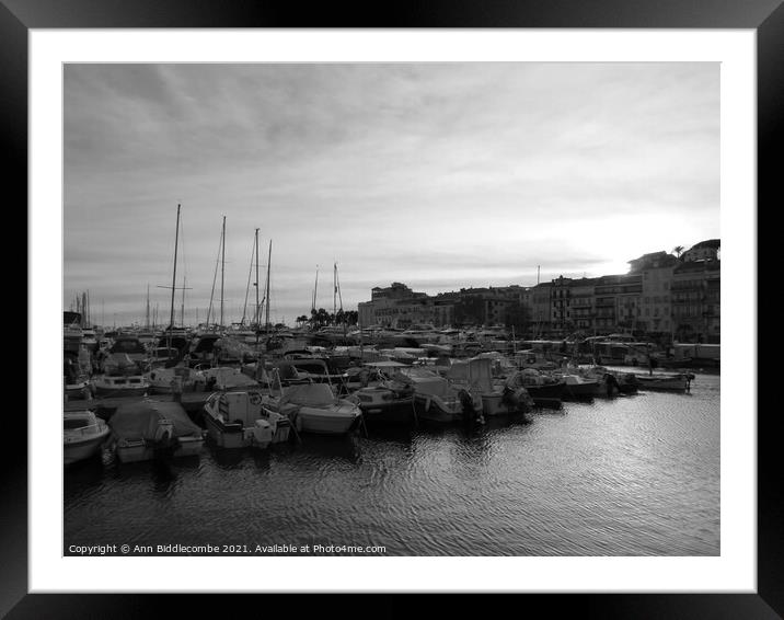 Monochrome Cannes marina at sunset Framed Mounted Print by Ann Biddlecombe