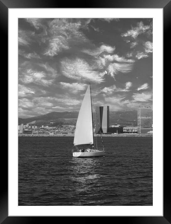 lone sailing boat on the coast of Marseille in mon Framed Mounted Print by Ann Biddlecombe