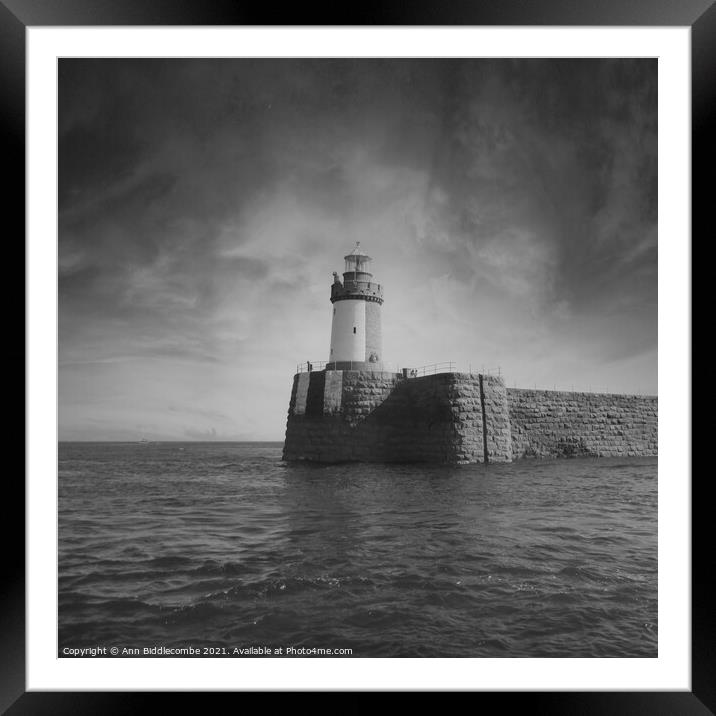Guernsey Lighthouse from the sea in black and whit Framed Mounted Print by Ann Biddlecombe