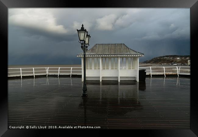 Stormy day at Cromer Pier Framed Print by Sally Lloyd