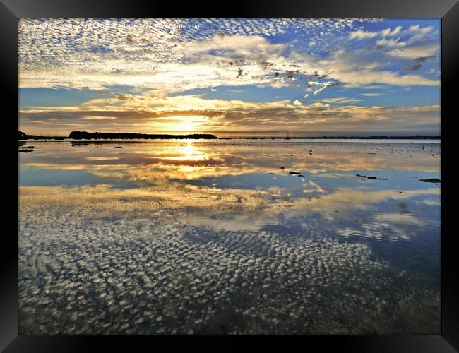 Sunset reflections. Framed Print by paul cobb