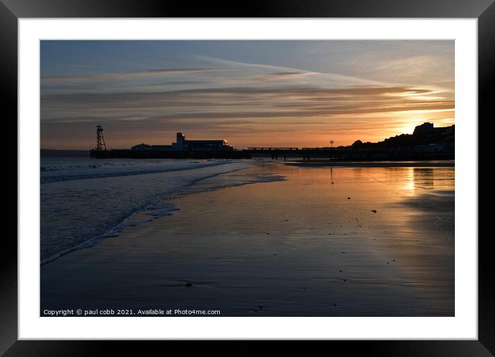 Sunset over the pier. Framed Mounted Print by paul cobb