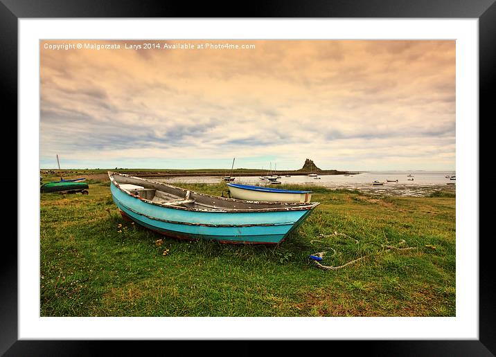 An old boat at the beach, Holy Island, England Framed Mounted Print by Malgorzata Larys