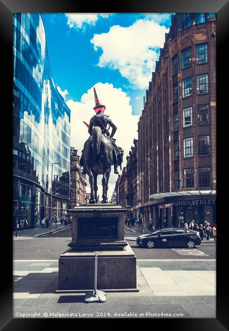 Statue of Duke of Wellington riding a horse, weari Framed Print by Malgorzata Larys