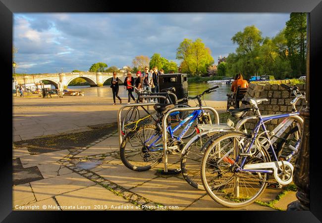 Bikes at the river bank in Richmond Framed Print by Malgorzata Larys
