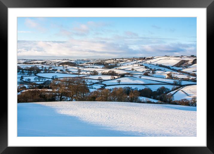 Devon's Snowy Patchwork Framed Mounted Print by Dave Rowlatt
