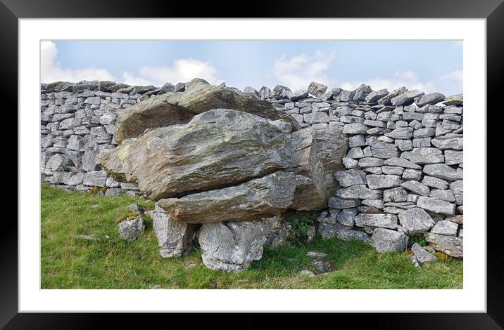 Glacial erratic in a wall.  Framed Mounted Print by Mark Godden