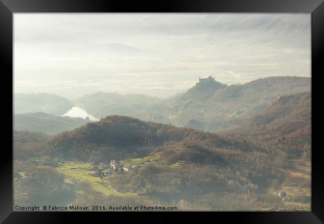 Autumnal landscape and fog over the castle Framed Print by Fabrizio Malisan