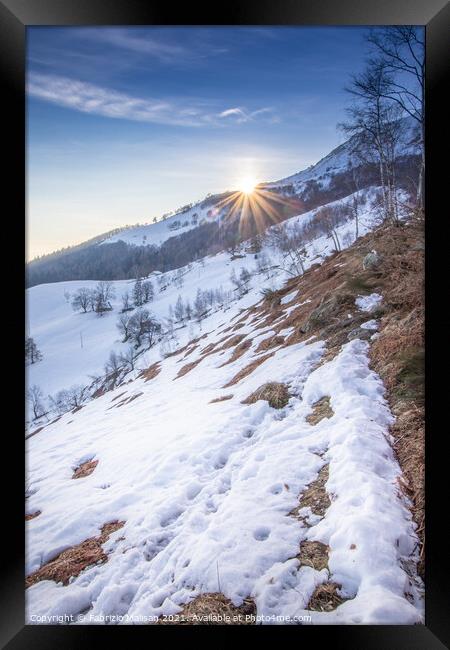 The Sun Sets Behind The Mountain Snow Winter Weather Italy Framed Print by Fabrizio Malisan