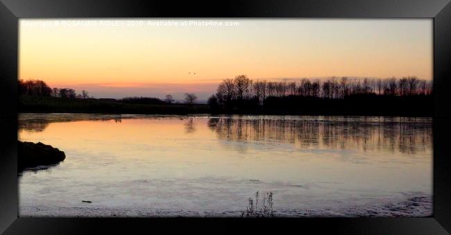 "Sunset across the frozen lake"  Framed Print by ROS RIDLEY