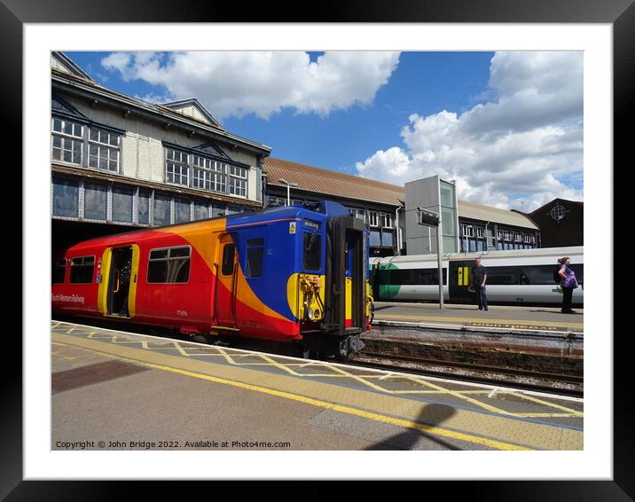 SWR Train at Clapham Junction  Framed Mounted Print by John Bridge