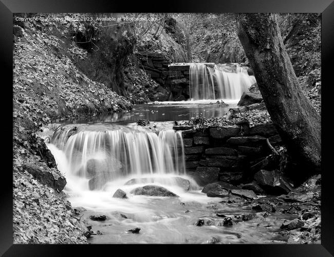 Winter scene of waterfall stream slow shutter blac Framed Print by Andrew Heaps