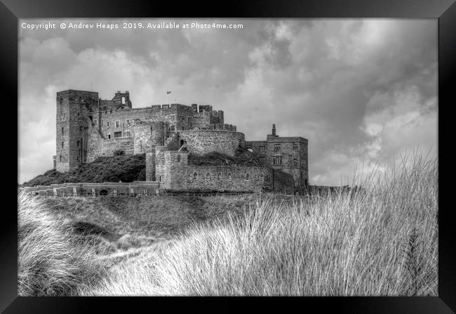Bamburgh Castle in black and white. Framed Print by Andrew Heaps